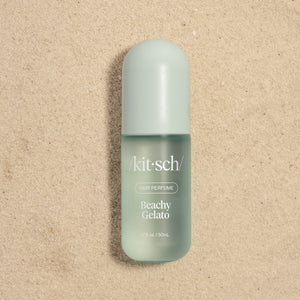 Kitsch Beachy Gelato Hair Perfume 50mL bottle on sandy background – cruelty-free beachy hair scent