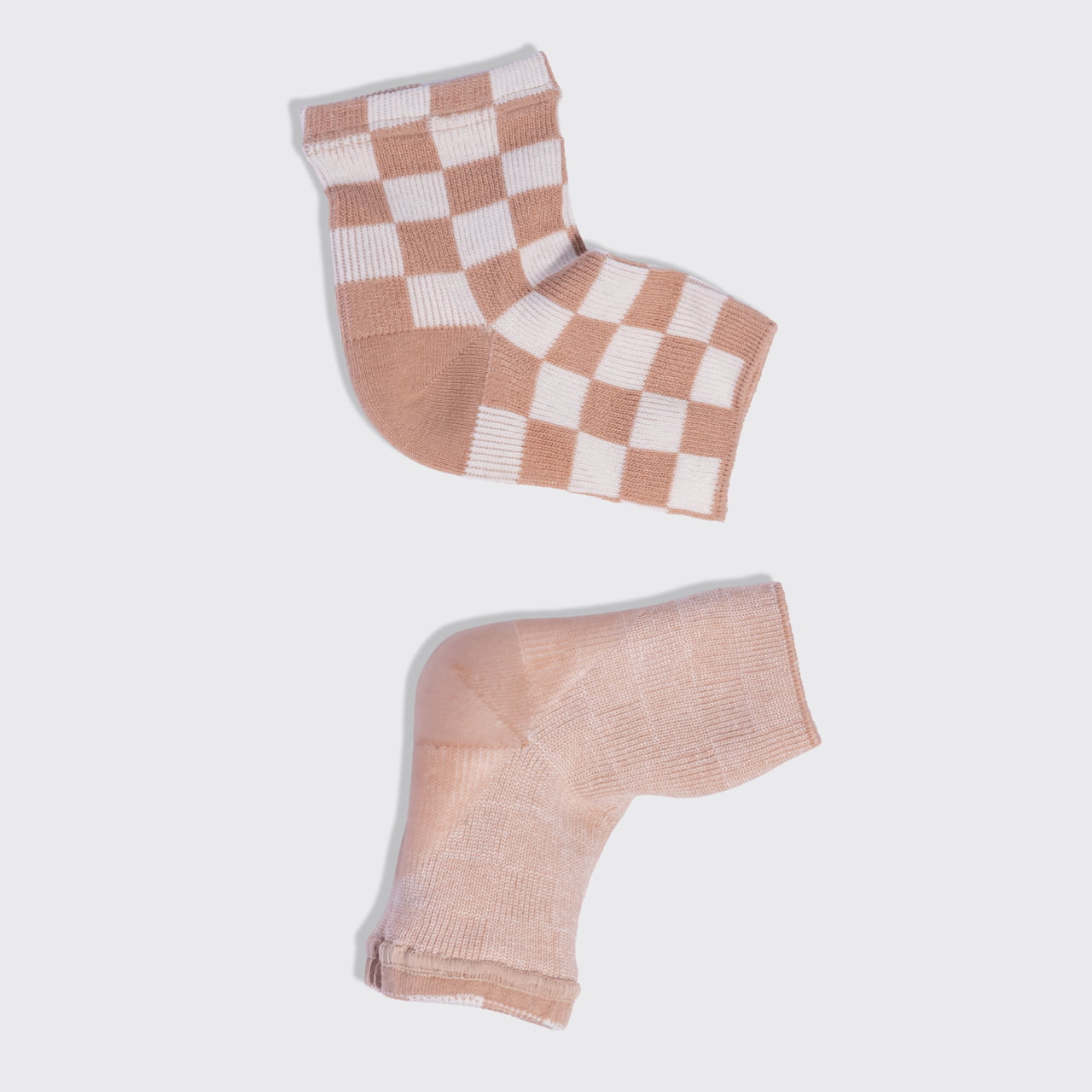 Kitsch Terracotta Checker Moisturizing Heel Socks showing the checked exterior and gel-lined moisturizing heel interior.