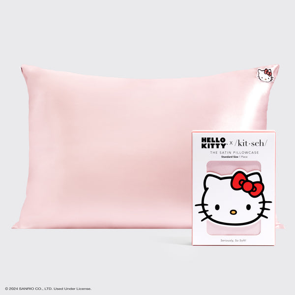 KITSCH Kitsch x Hello Kitty Satin Pillowcase in Pink Hello Kitty Face — pink satin pillowcase shown with its Hello Kitty packaging card — helps to tame frizz & reduce breakage while sleeping by creating less friction — overnight hair protection
