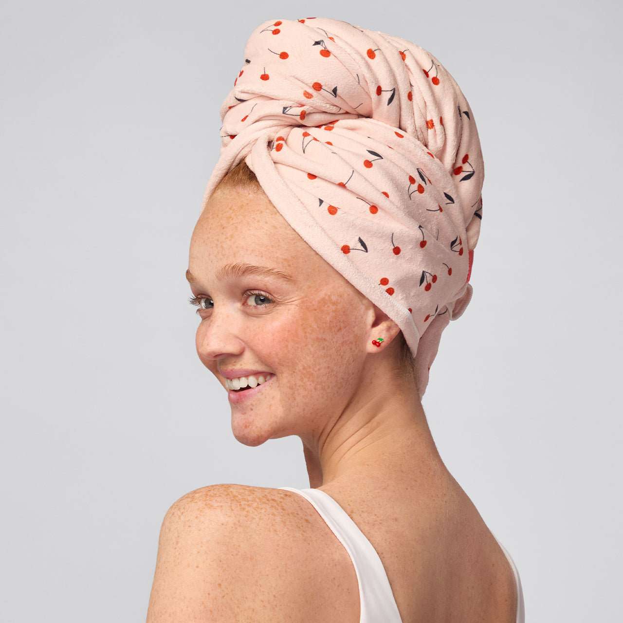 KITSCH XL Hair Towel Wrap — Cherry Print — worn on model, twisted and secured with elastic strap
