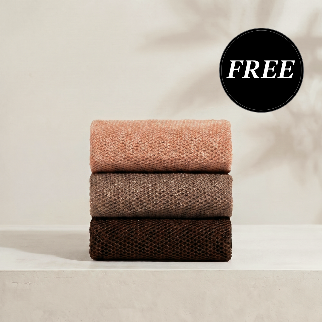 Kitsch Rosewood African Net Sponge set shown stacked in three terracotta tones, displaying the exfoliating mesh texture on a soft neutral background