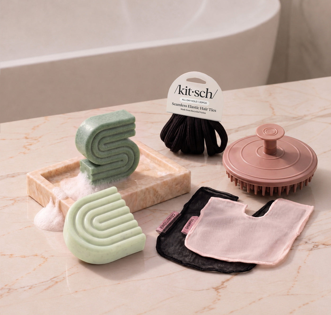 Rosemary & Biotin: Kitsch Free Welcome Kit with Rosemary & Biotin shampoo and conditioner bars, Terracotta Scalp Exfoliator, Blush Shampoo Bar Bag, Black Conditioner Bar Bag, and Black Seamless Hair Elastics.