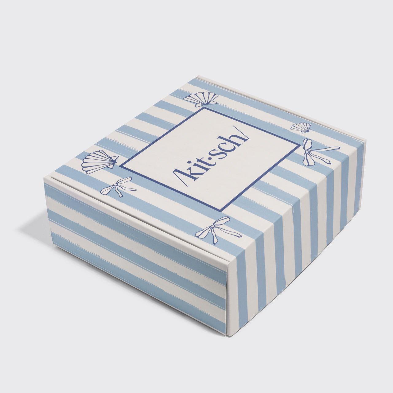 Kitsch striped Summer box with 9 full size Kitsch favorites inside on a light gray background